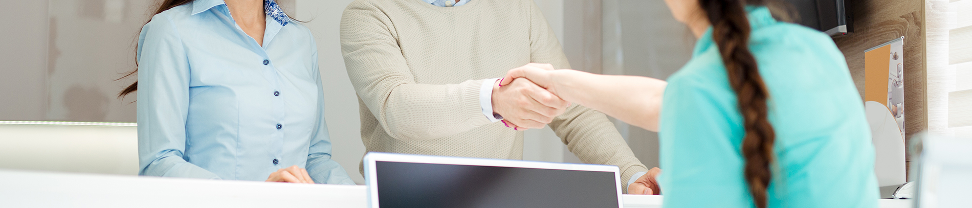 The image shows a modern dental clinic interior with various pieces of equipment, including a dental chair and an X-ray machine.
